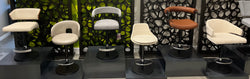 Elite Modern display of adjustable stools in assorted upholstery finishes