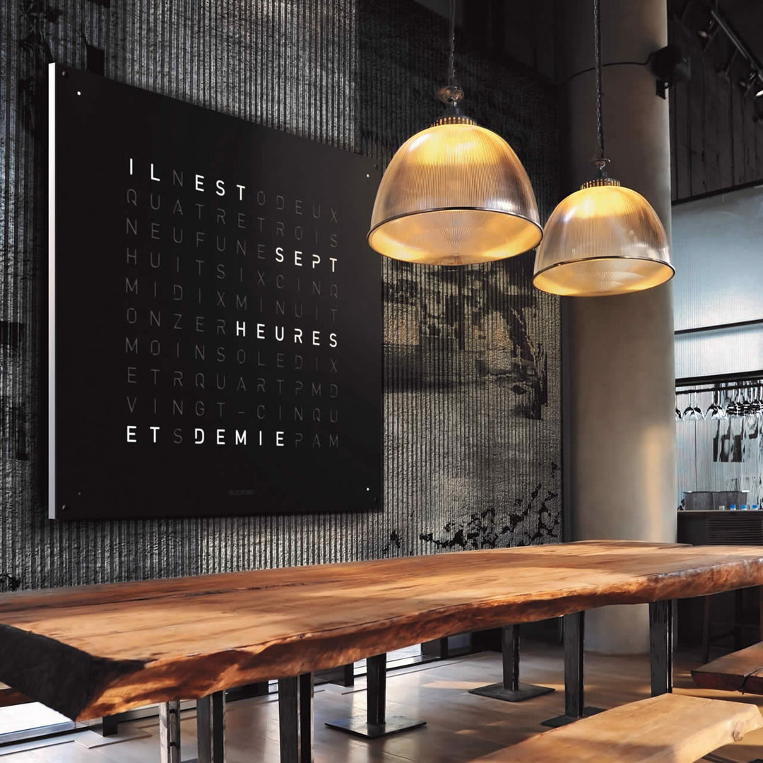 QlockTwo modern digital wall clock displaying time with words