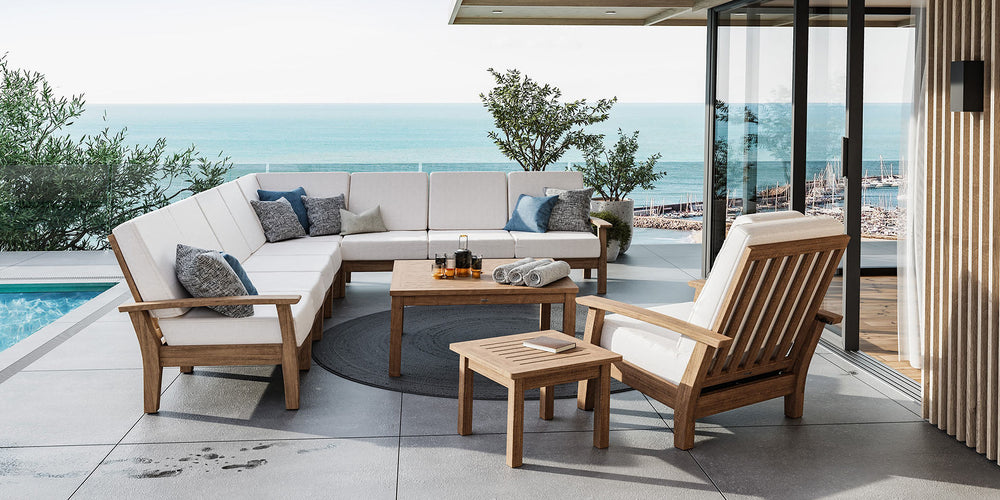 Barlow Tyrie Haven teak deep-seating furniture beside a pool