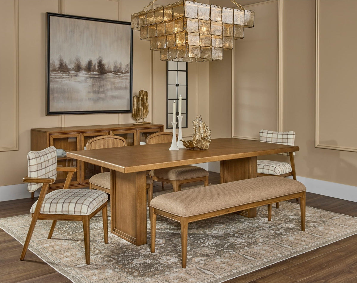 Modus Carlisle dining table with bench and chairs in a warm dining room