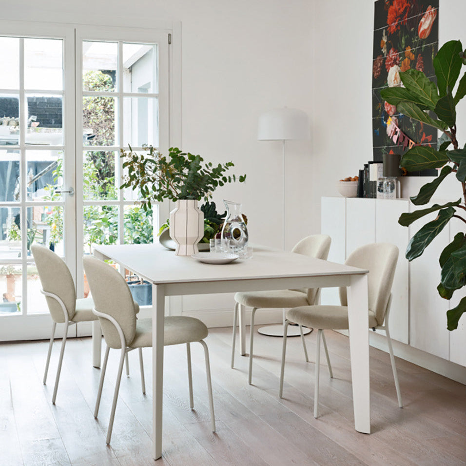 Connubia Cozy Mid Dining Chairs around a white dining table