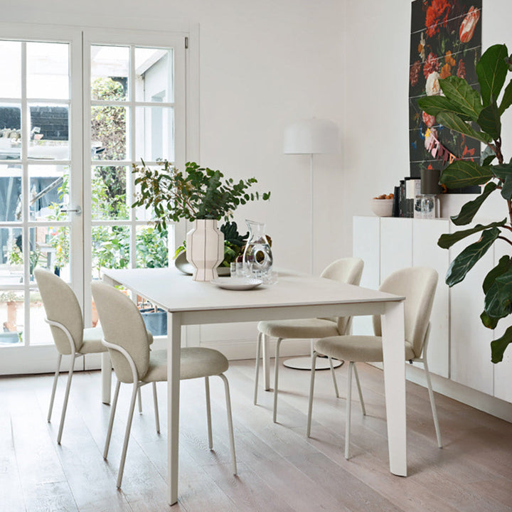 Connubia Cozy Mid Dining Chairs around a white dining table