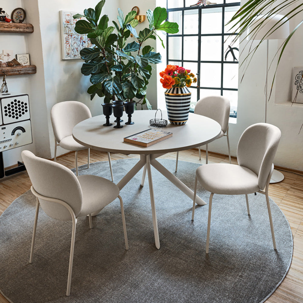 Connubia Cozy Mid Dining Chairs around a round dining table