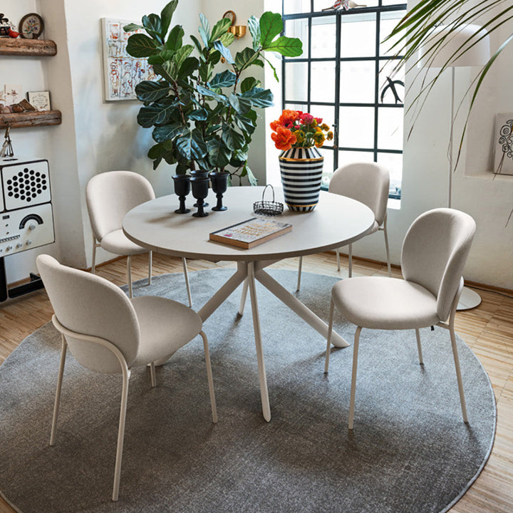 Connubia Cozy Mid Dining Chairs around a round dining table