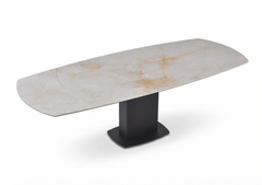 Kube Tuscany dining table with a light beige veined ceramic top and black pedestal base, shown extended.