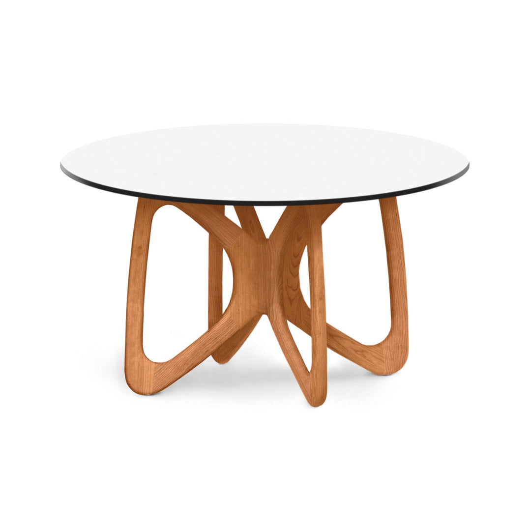 Butterfly Round Glass Top Dining Table in a modern dining room