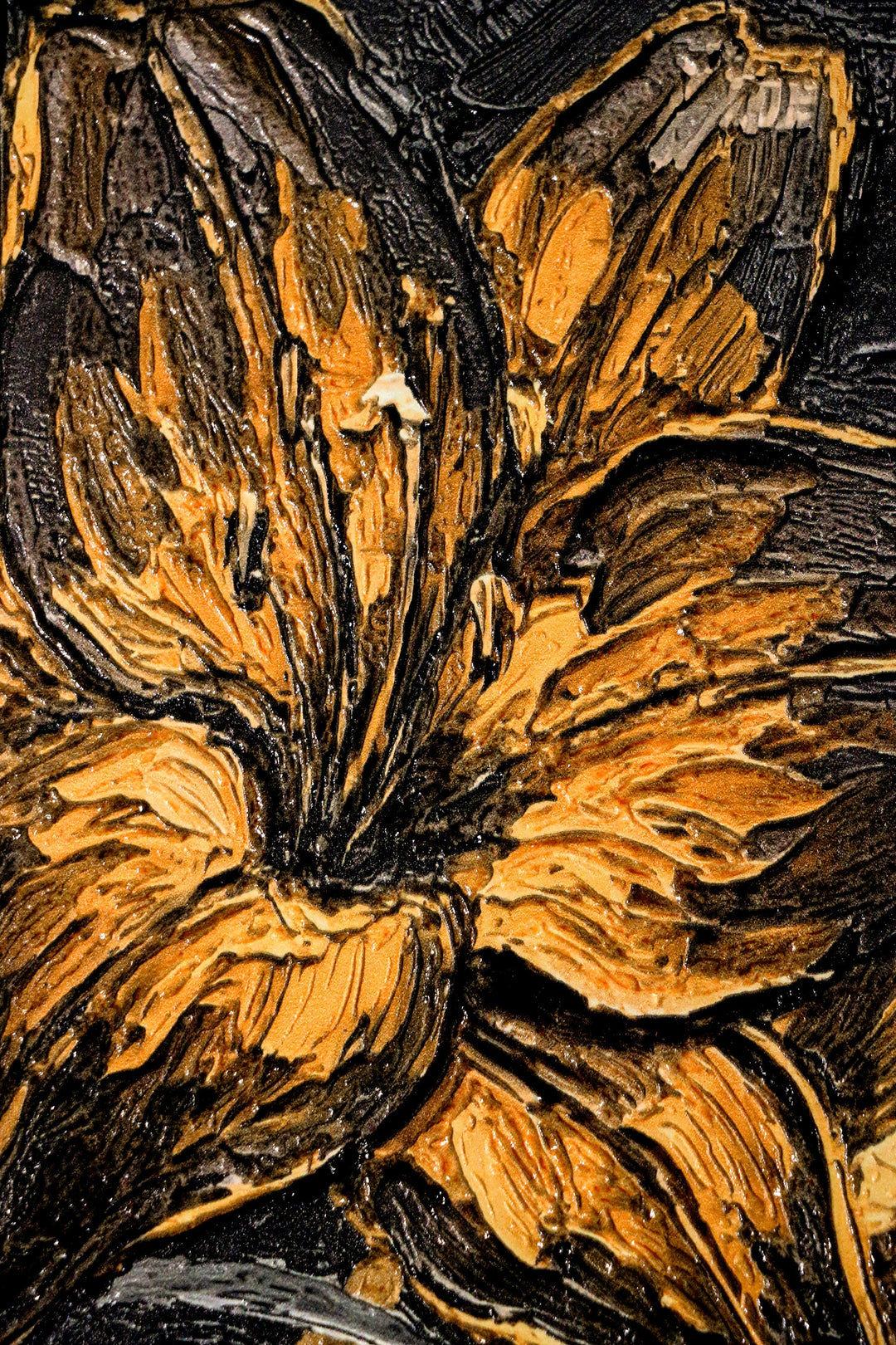 Close-up of a textured surface with floral patterns in brown and black.