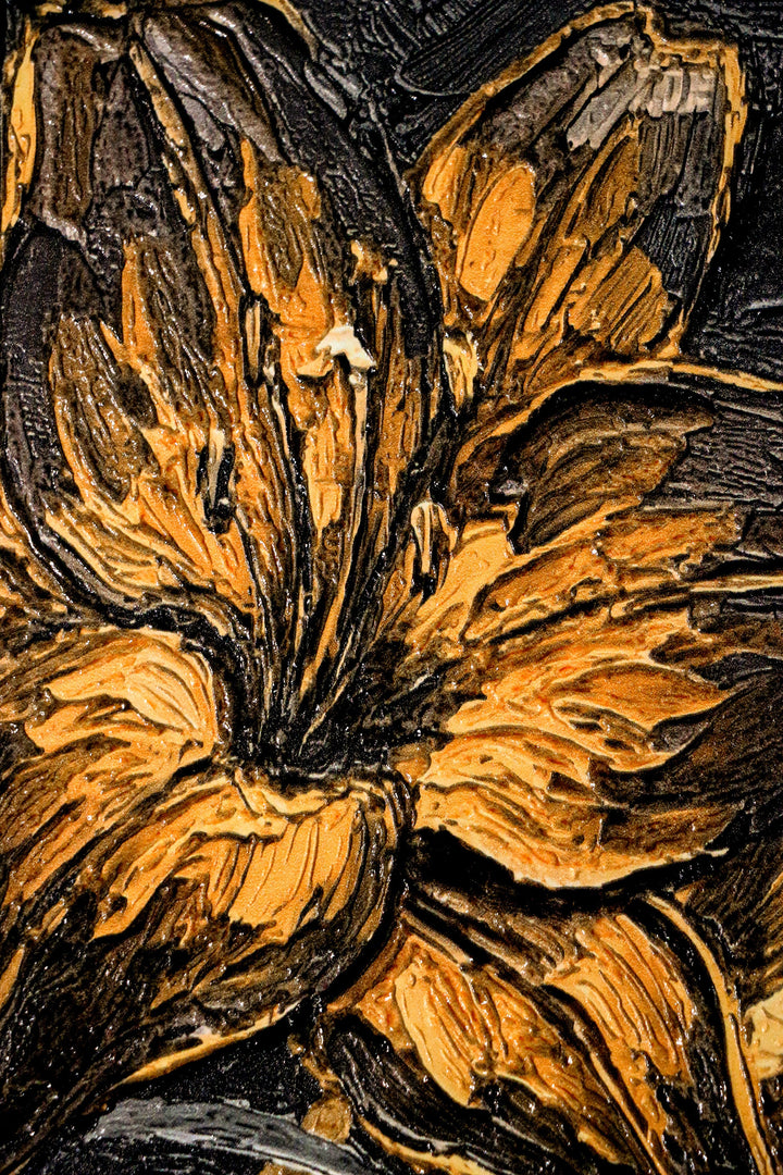 Close-up of a textured surface with floral patterns in brown and black.