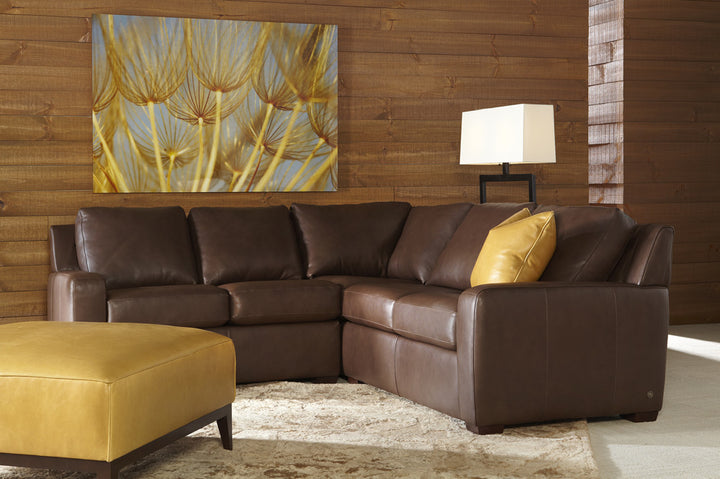 Lisben family room inspiration — smaller corner layout and separately sold ottoman; not the included two-piece configuration.
