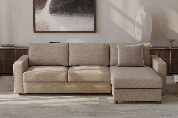 Beige Neah sleeper chaise sectional in a living room with framed art