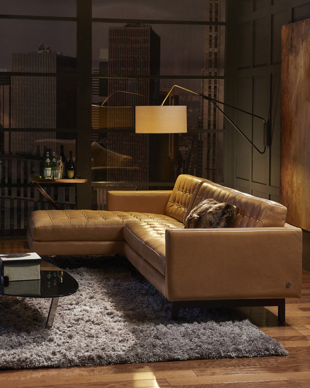 Parker sofa-chaise leather room scene; mirrored chaise-left layout, accessories not included.