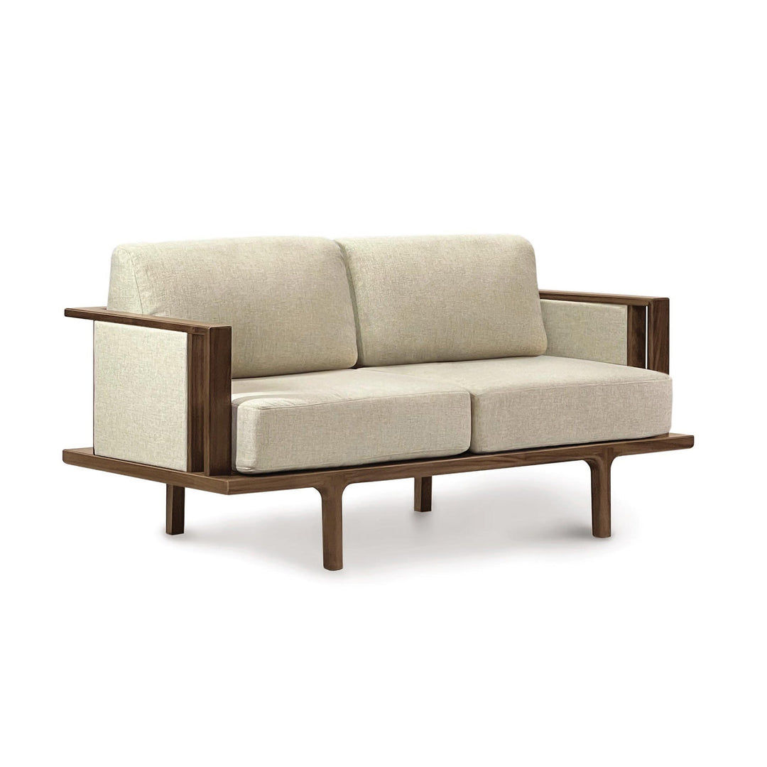Sierra upholstered-panel loveseat in natural walnut