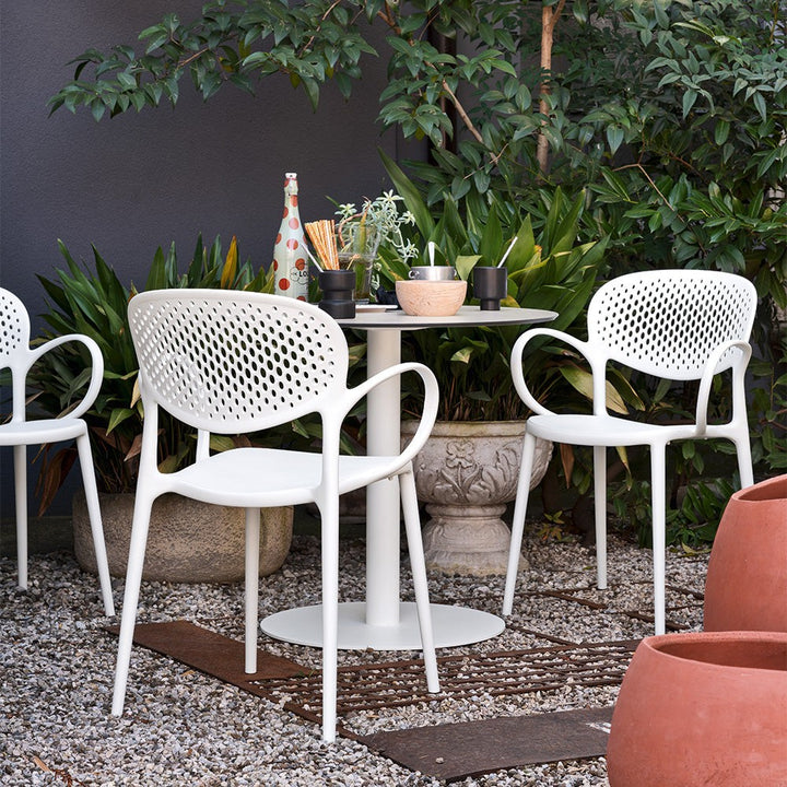 Abby Perforated Dining Armchair by Connubia in a styled interior