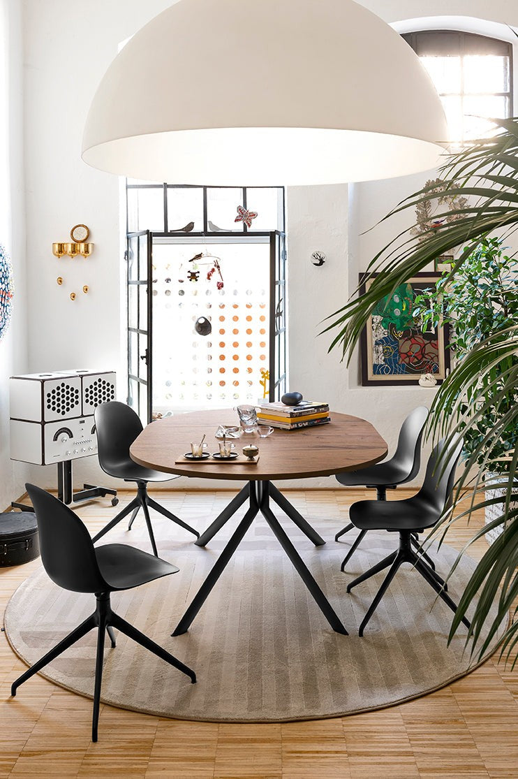 Academy Aluminum Swivel Dining Chair by Connubia in a styled interior