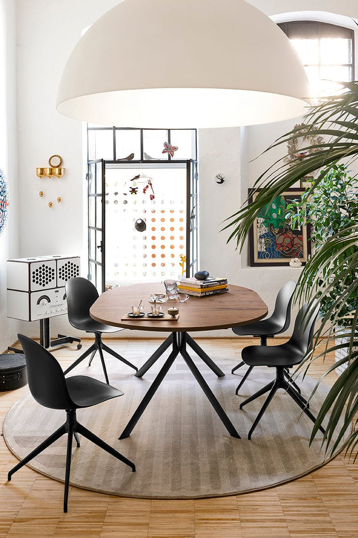 Academy Aluminum Swivel Dining Chair by Connubia in a styled interior