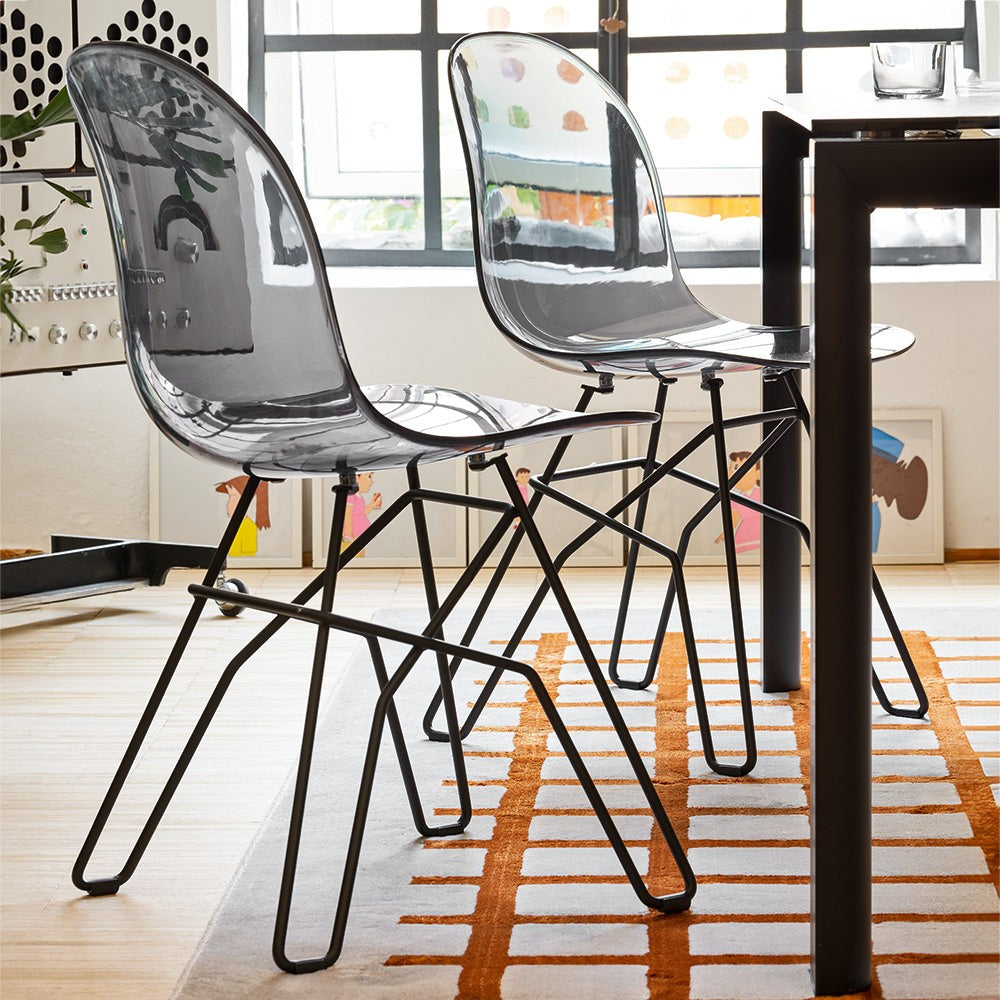 Academy Clear Metal Crossbar Dining Chair by Connubia in a styled interior