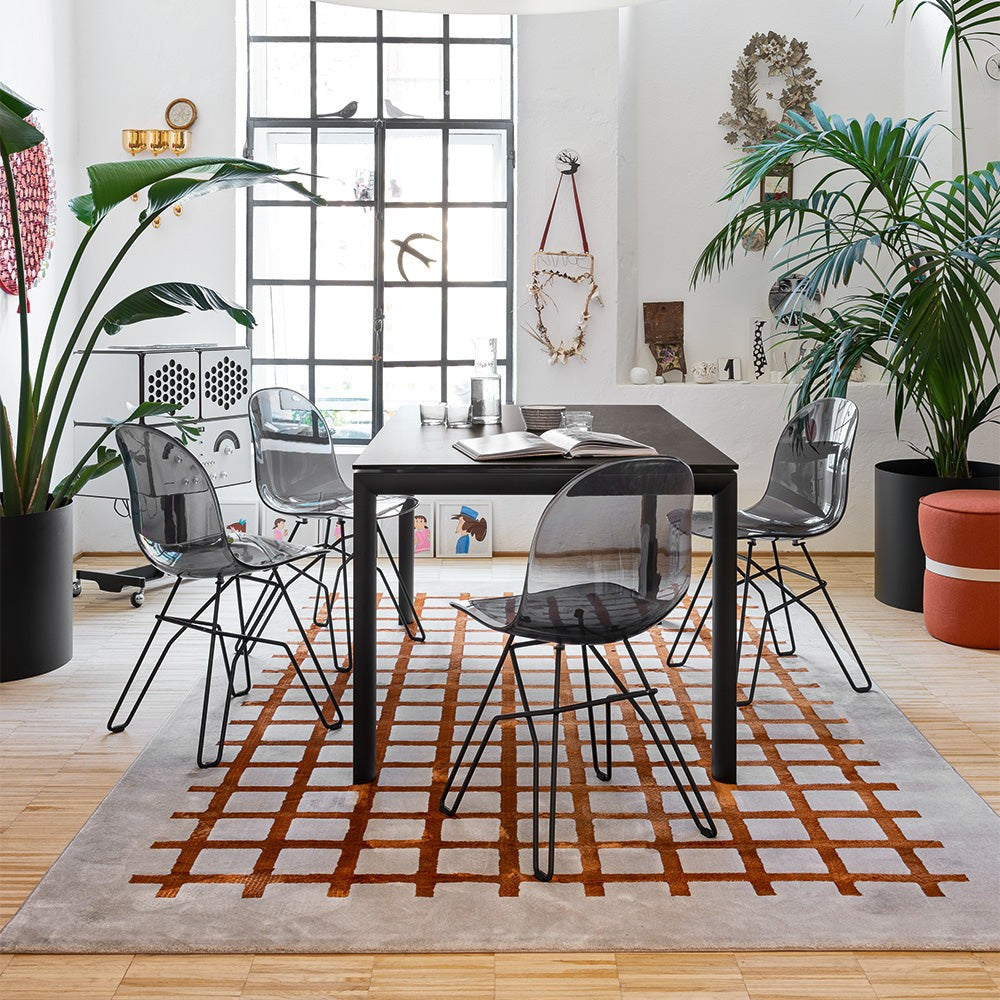 Academy Clear Metal Crossbar Dining Chair by Connubia in a styled interior