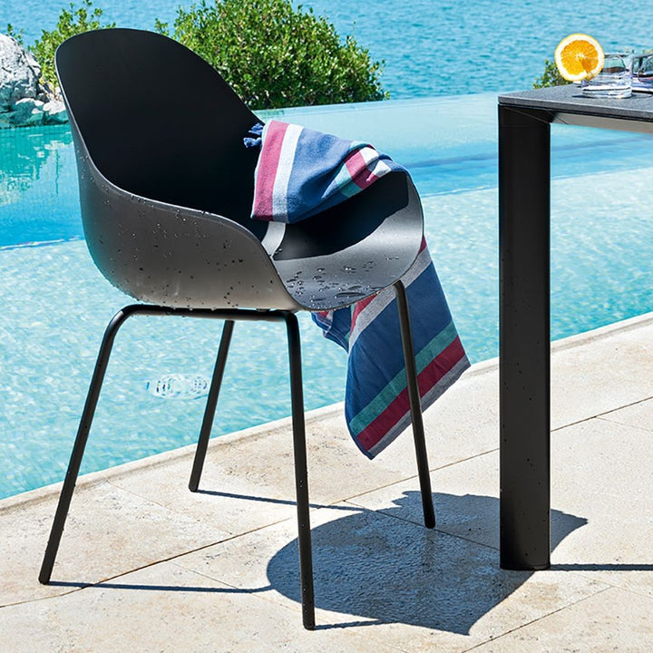 Academy Outdoor Dining Armchair by Connubia in a styled interior
