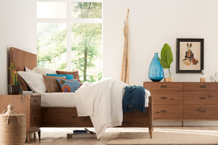 Adler Six Drawer Dresser in Natural Walnut — in a bedroom setting