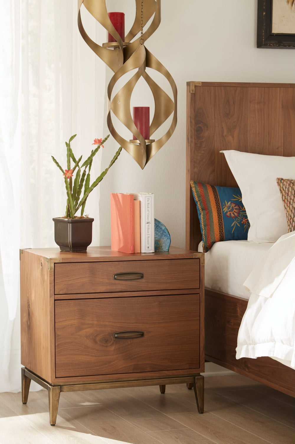 Adler Two Drawer Nightstand in Natural Walnut — in a bedroom setting