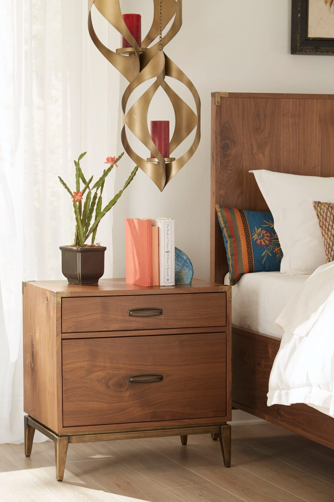 Adler Two Drawer Nightstand in Natural Walnut — in a bedroom setting