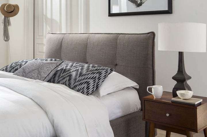 Adona Upholstered Footboard Storage Bed in Dolphin Linen styled in a bedroom