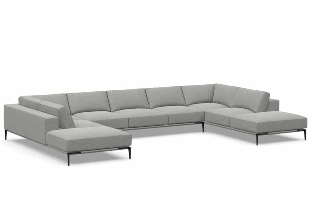 Copenhagen five-seat double-bumper sectional by American Leather, complete angled view on white