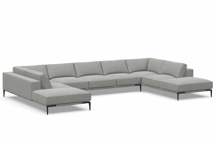 Copenhagen five-seat double-bumper sectional by American Leather, complete angled view on white