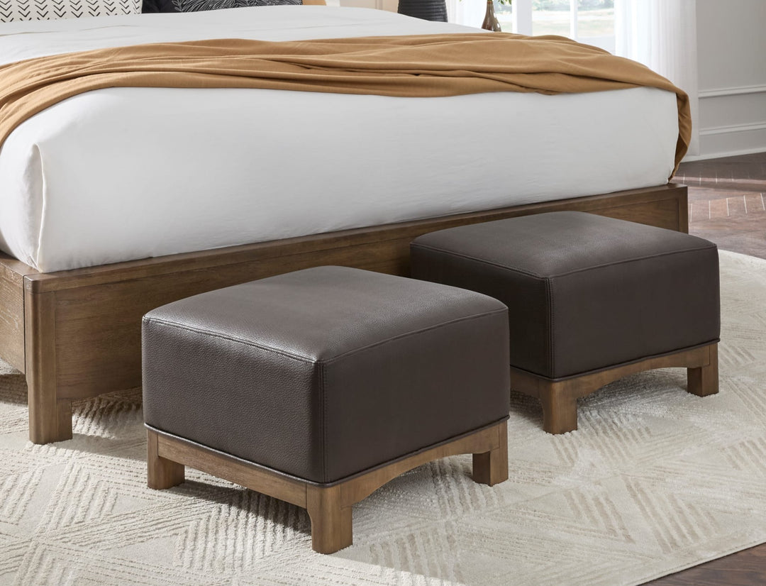 Arden Upholstered Ottoman in Tavern Brown — styled in a room