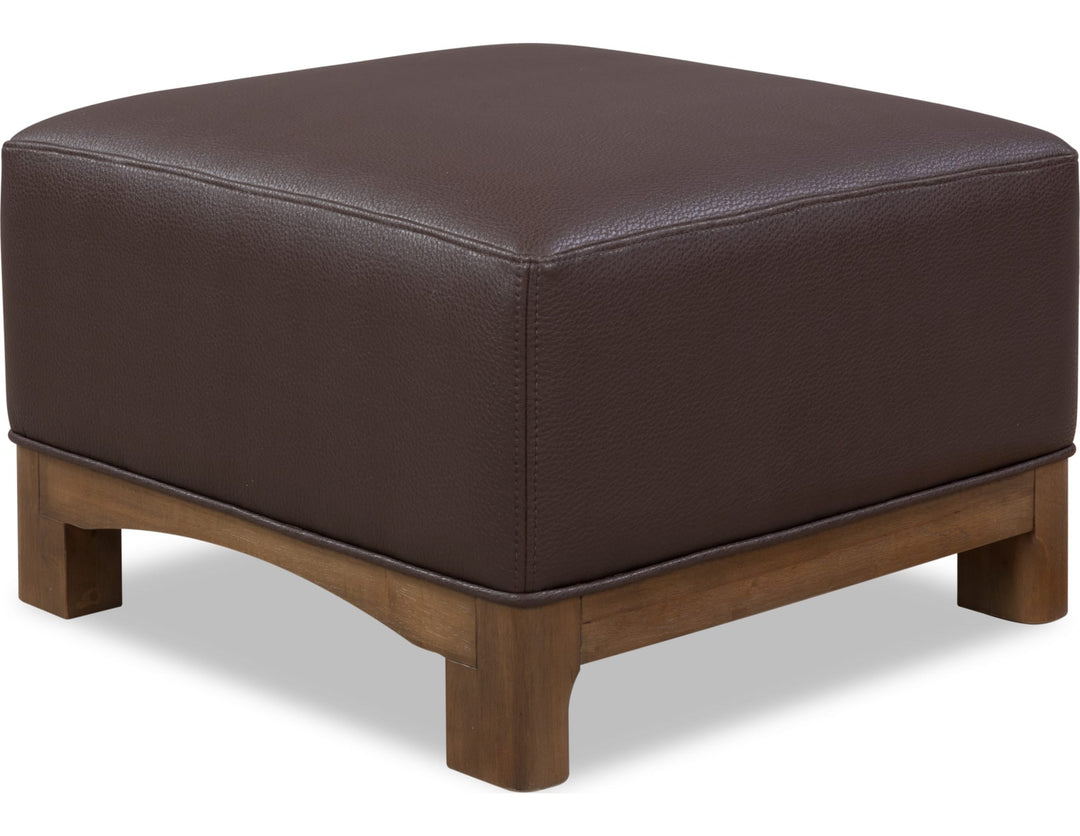 Arden Upholstered Ottoman in Tavern Brown — on a white background