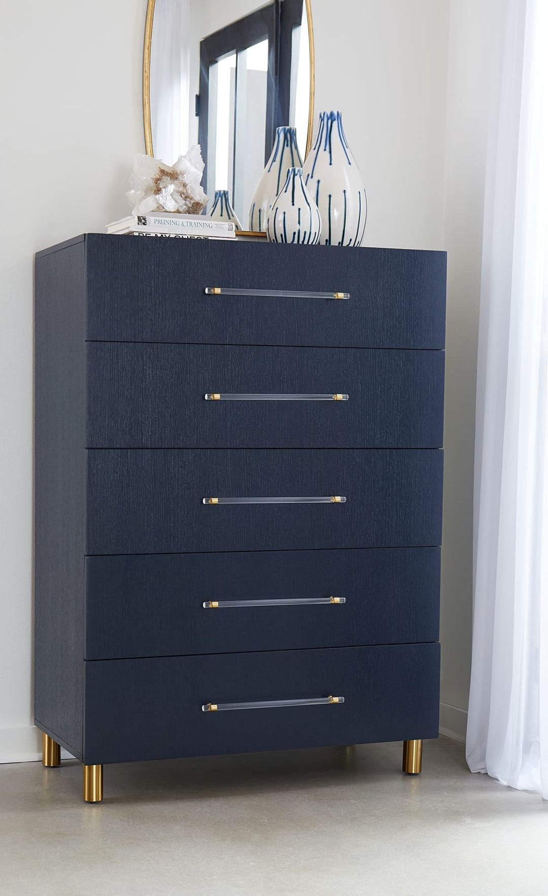 Argento Five Drawer Chest in Navy Blue &amp; Burnished Brass — styled in a room