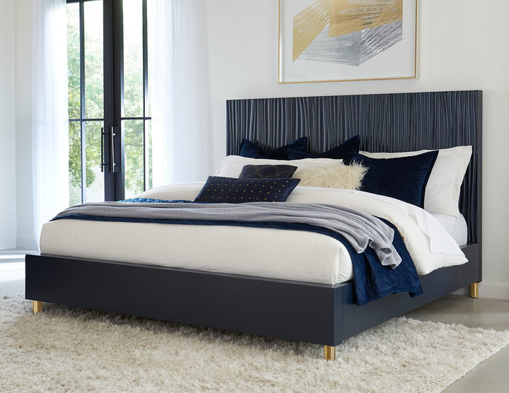 Argento Wave-Patterned Bed in Navy Blue &amp; Burnished Brass styled in a bedroom