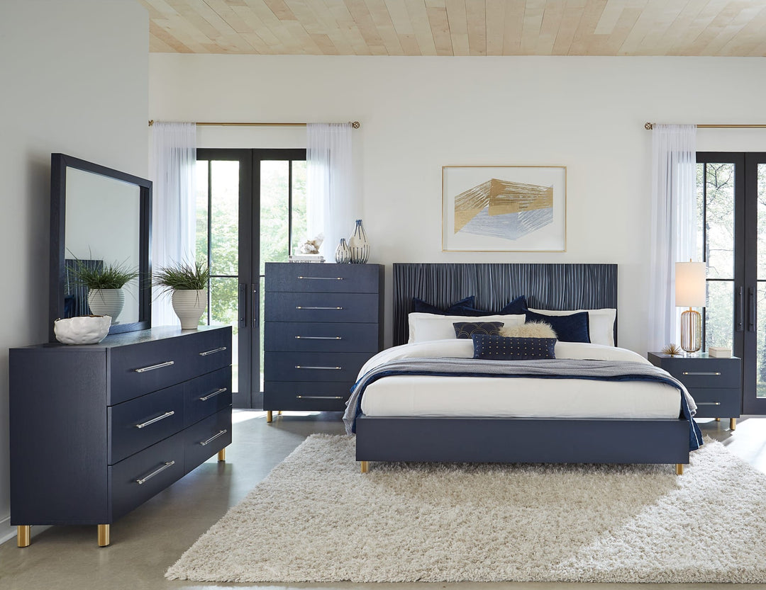 Argento Wave-Patterned Bed in Navy Blue &amp; Burnished Brass styled in a bedroom