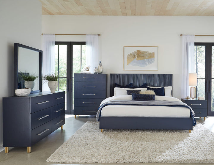 Argento Wave-Patterned Bed in Navy Blue &amp; Burnished Brass styled in a bedroom