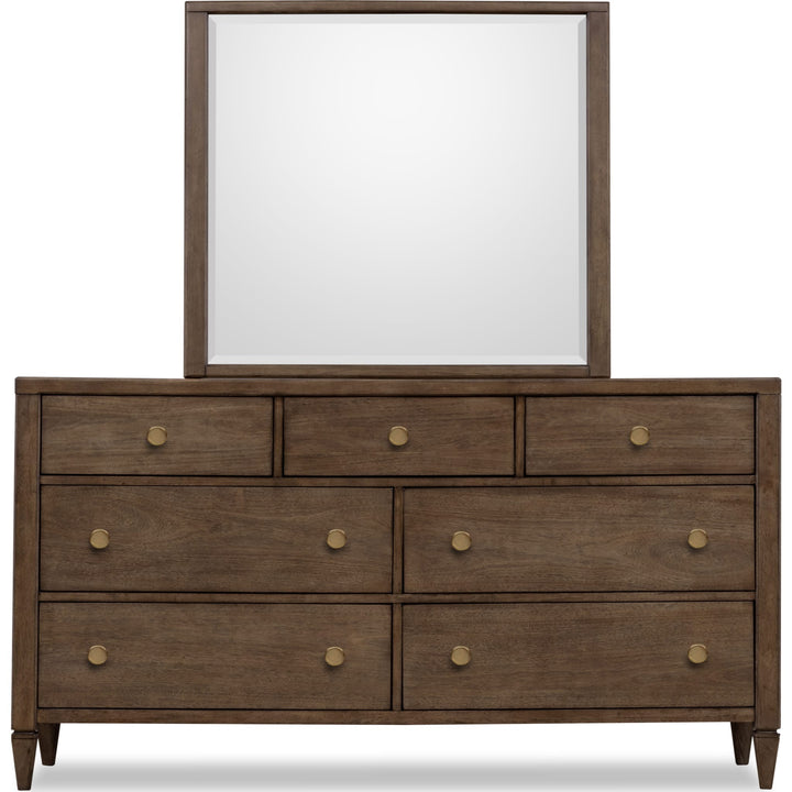 Ascott Seven Drawer Dresser in Pecan Pie — on a white background with the matching mirror (sold separately)