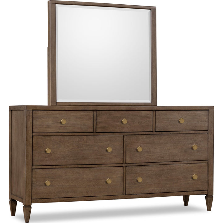 Ascott Seven Drawer Dresser in Pecan Pie — on a white background with the matching mirror (sold separately)