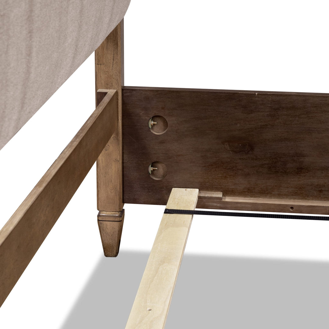 Ascott Upholstered Canopy Bed — close-up of the footboard post and side rail