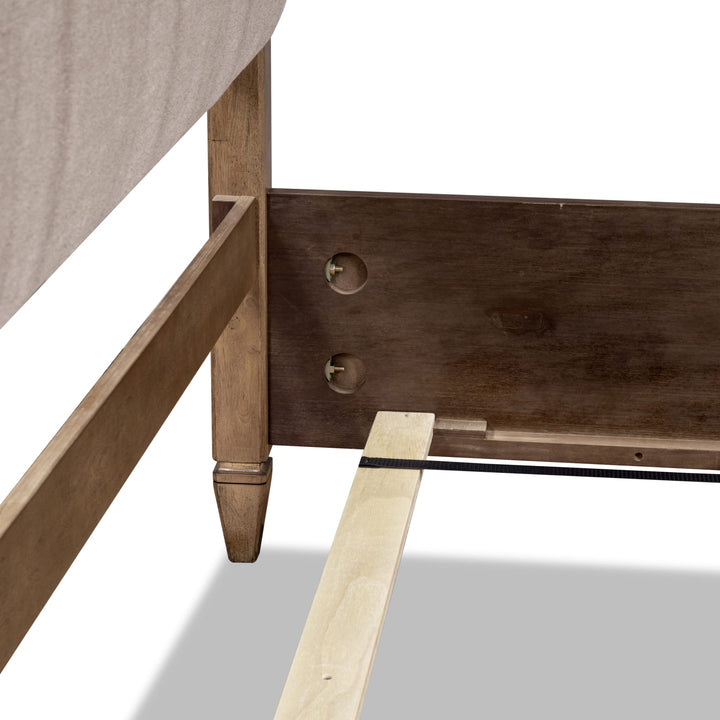 Ascott Upholstered Canopy Bed — close-up of the footboard post and side rail