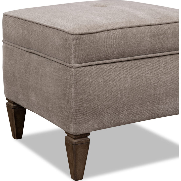 Ascott Upholstered Ottoman in Pecan Pie — on a white background