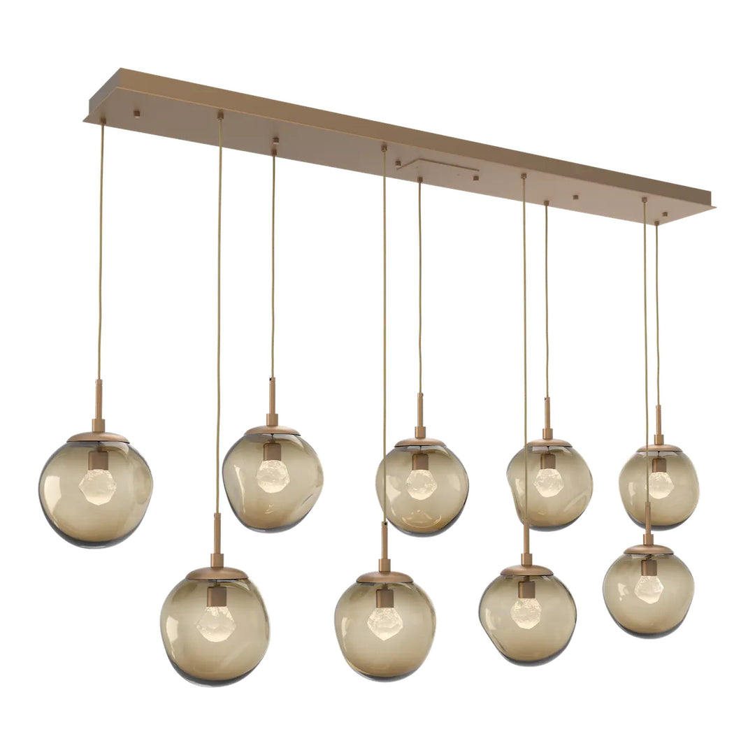 Aster Linear Pendant Chandelier by Hammerton Studio 9 Lights in Novel Brass with Bronze glass (LED)