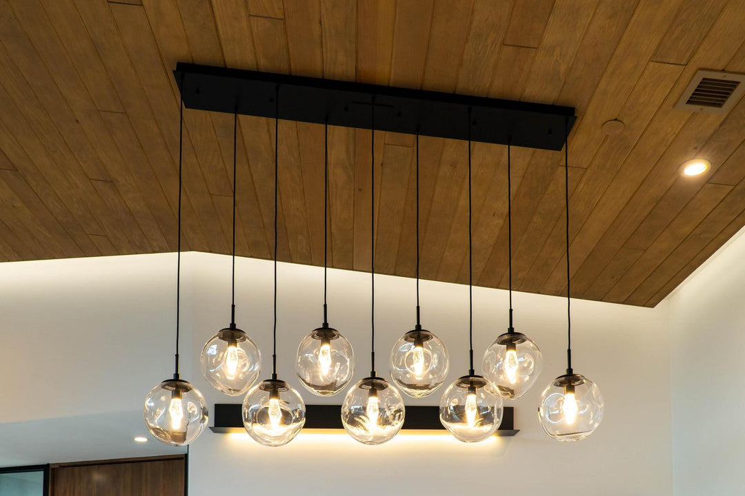 Aster Linear Pendant Chandelier by Hammerton Studio in a styled interior