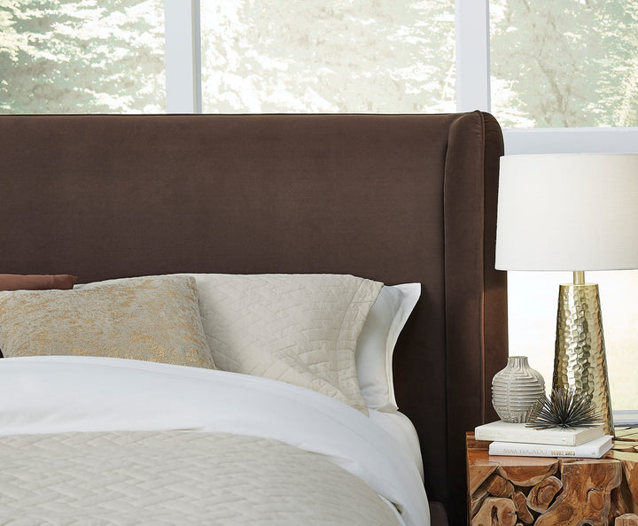 Bacall Velvet Upholstered Wingback Platform Bed in Cola styled in a bedroom