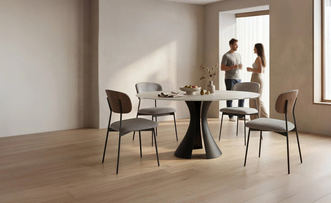Bloom 7722 60" Round Dining Table in Oyster / Black with Cove chairs in a dining room