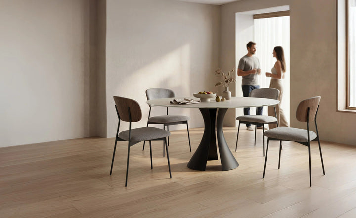 Bloom 7722 60" Round Dining Table in Oyster / Black with Cove chairs in a dining room
