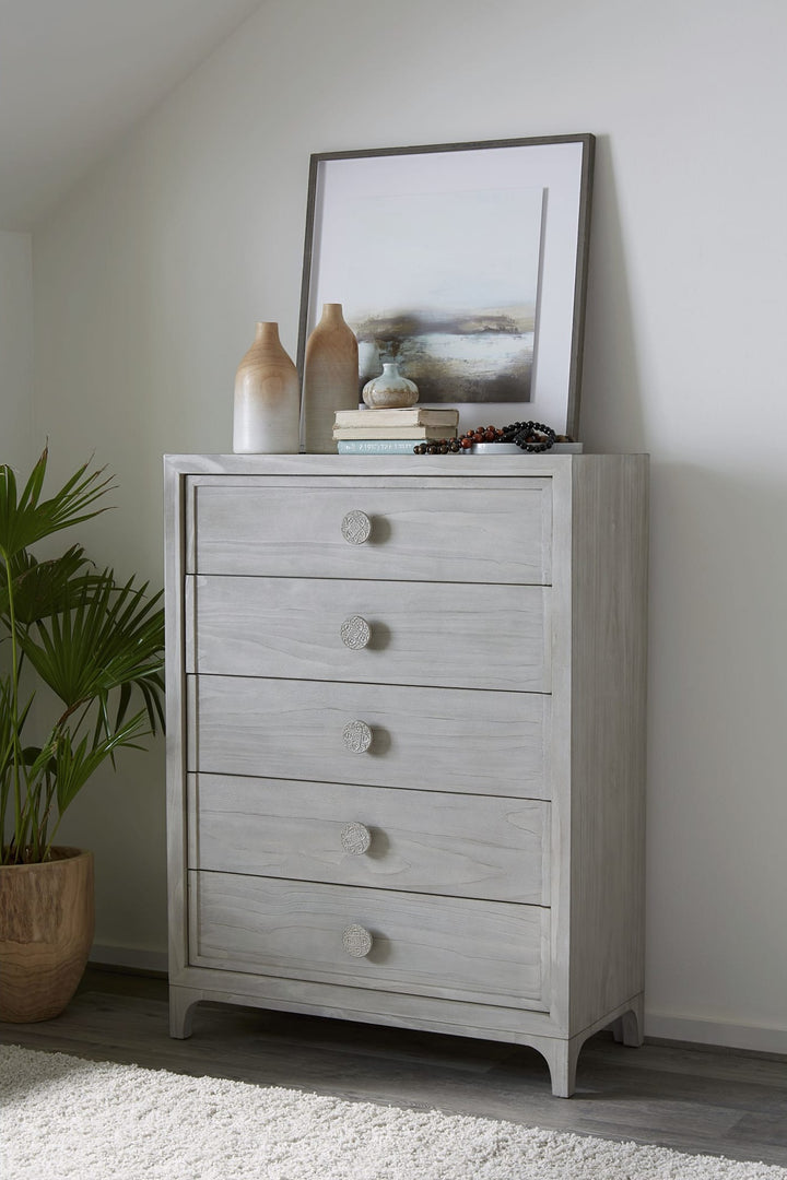 Boho Chic Five Drawer Chest in Washed White — styled in a room