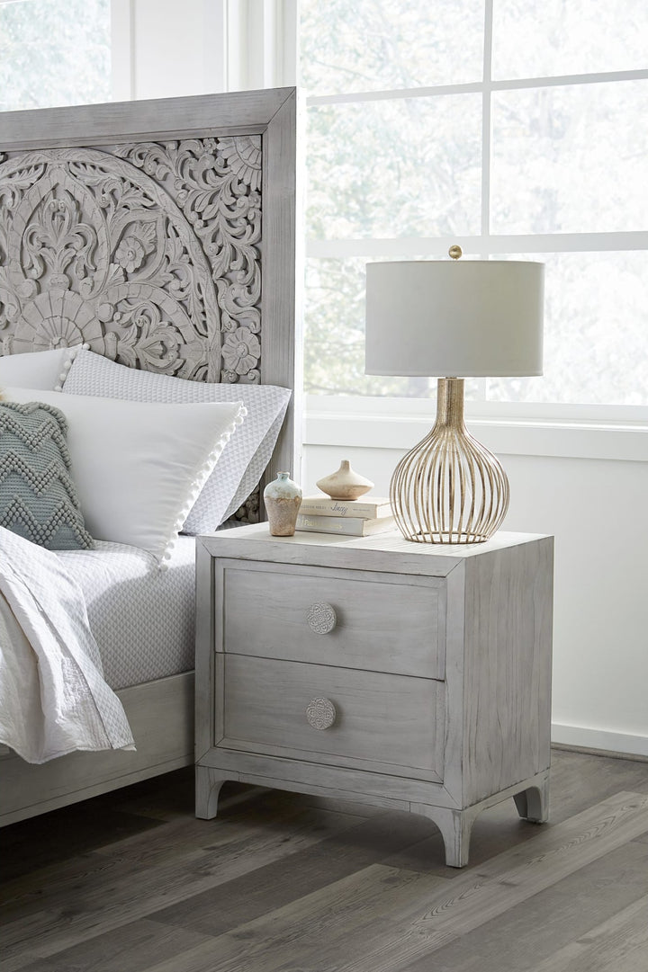 Boho Chic Two Drawer Nightstand in Washed White — in a bedroom setting