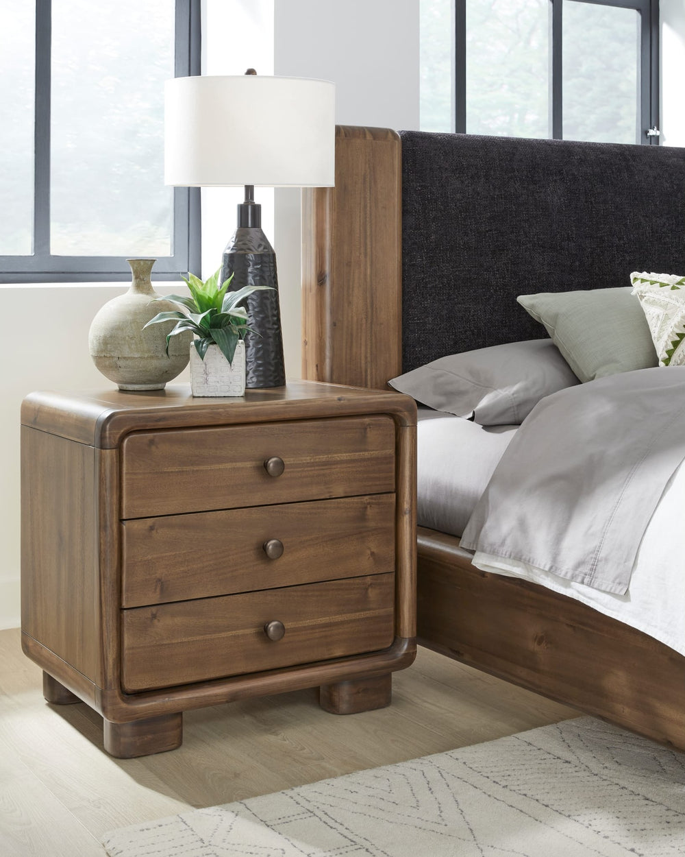 Boka Three Drawer Nightstand in Impala — in a bedroom setting