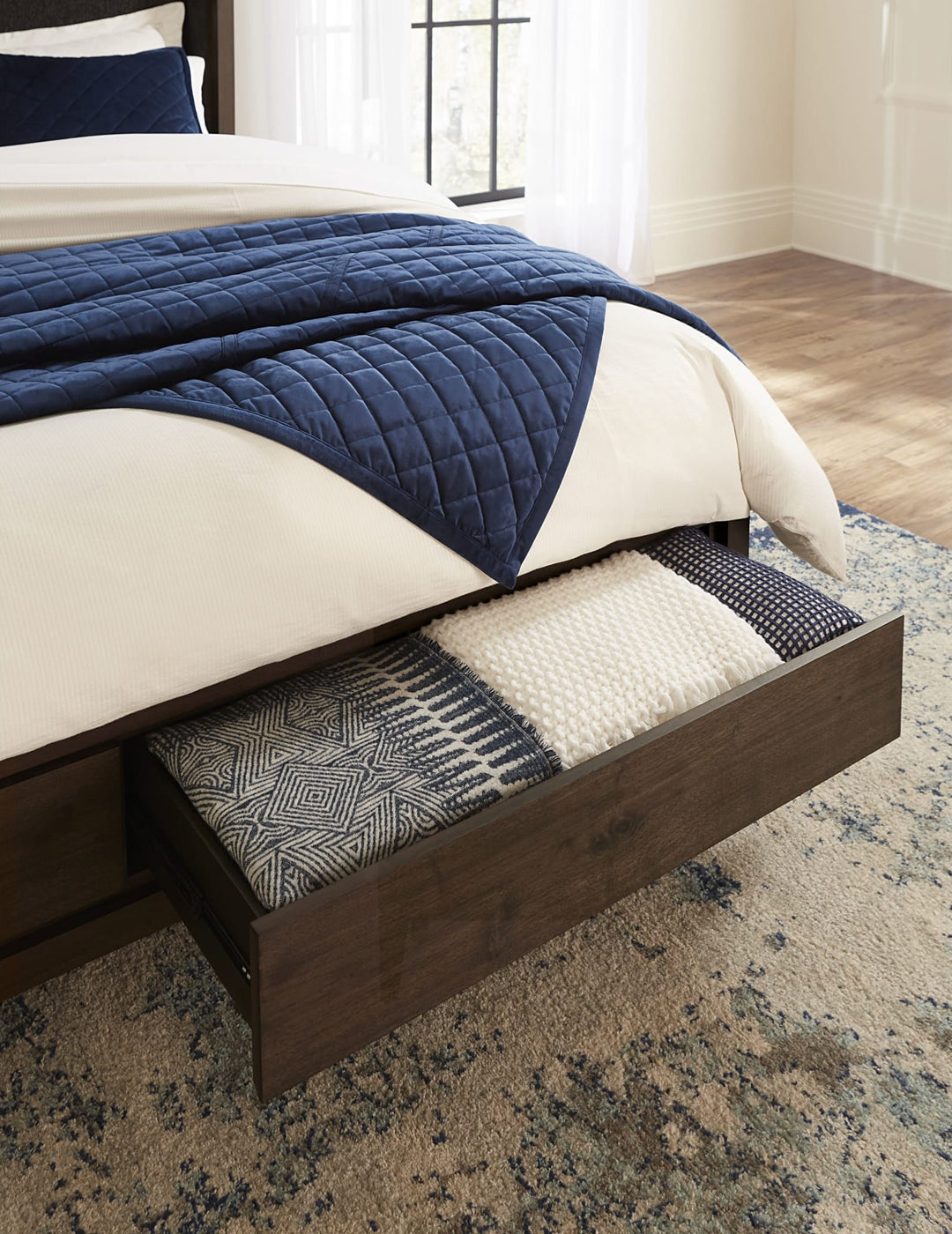 Boracay Upholstered Wingback Storage Bed in Wild Oats Brown styled in a bedroom