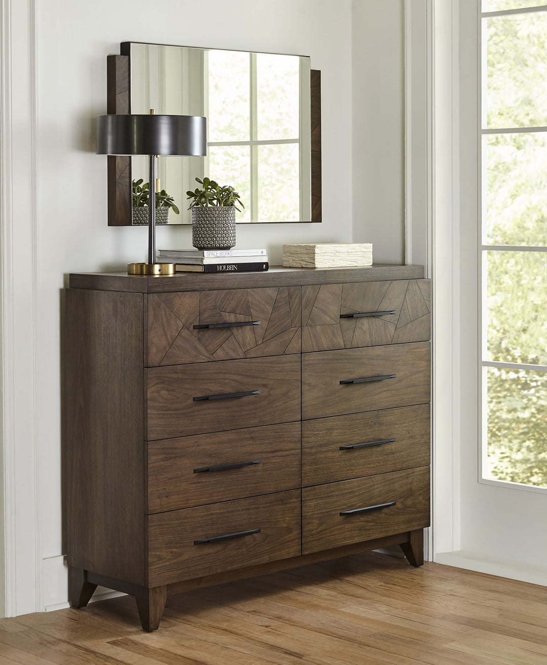 Broderick Eight Drawer Chesser by Modus in Wild Oats Brown — styled in a room