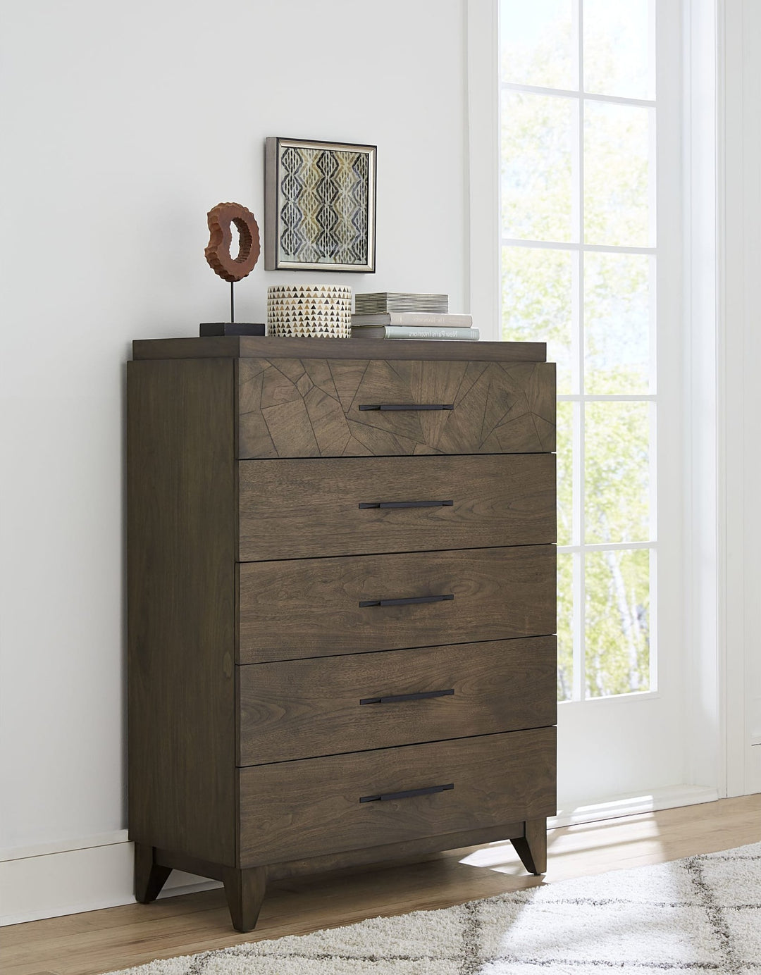 Broderick Five Drawer Chest in Wild Oats Brown — styled in a room